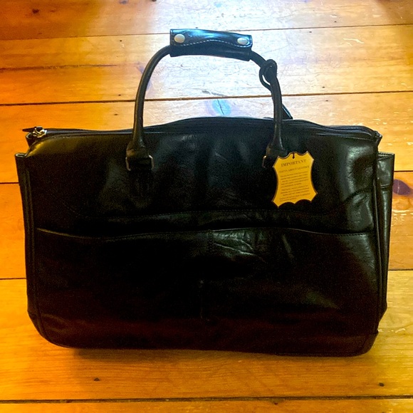 Brand New leather travel bag. Never used